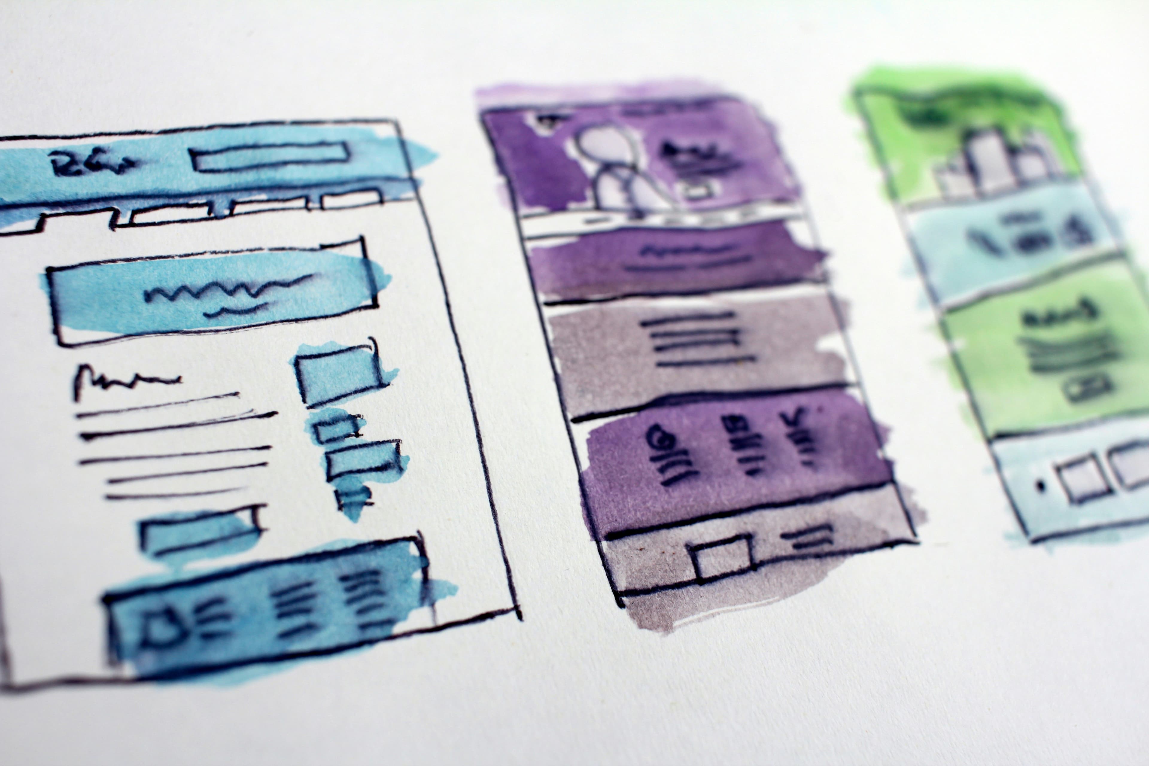 Business team planning website design strategy on a laptop